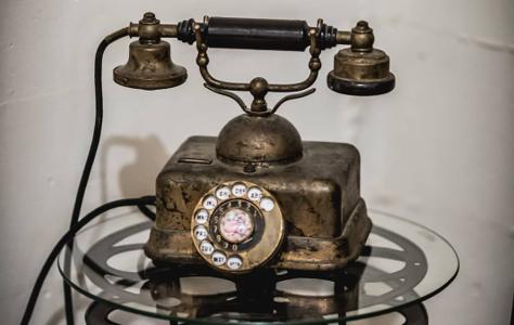 An antique rotary telephone, one of the curated vintage props throughout the venue